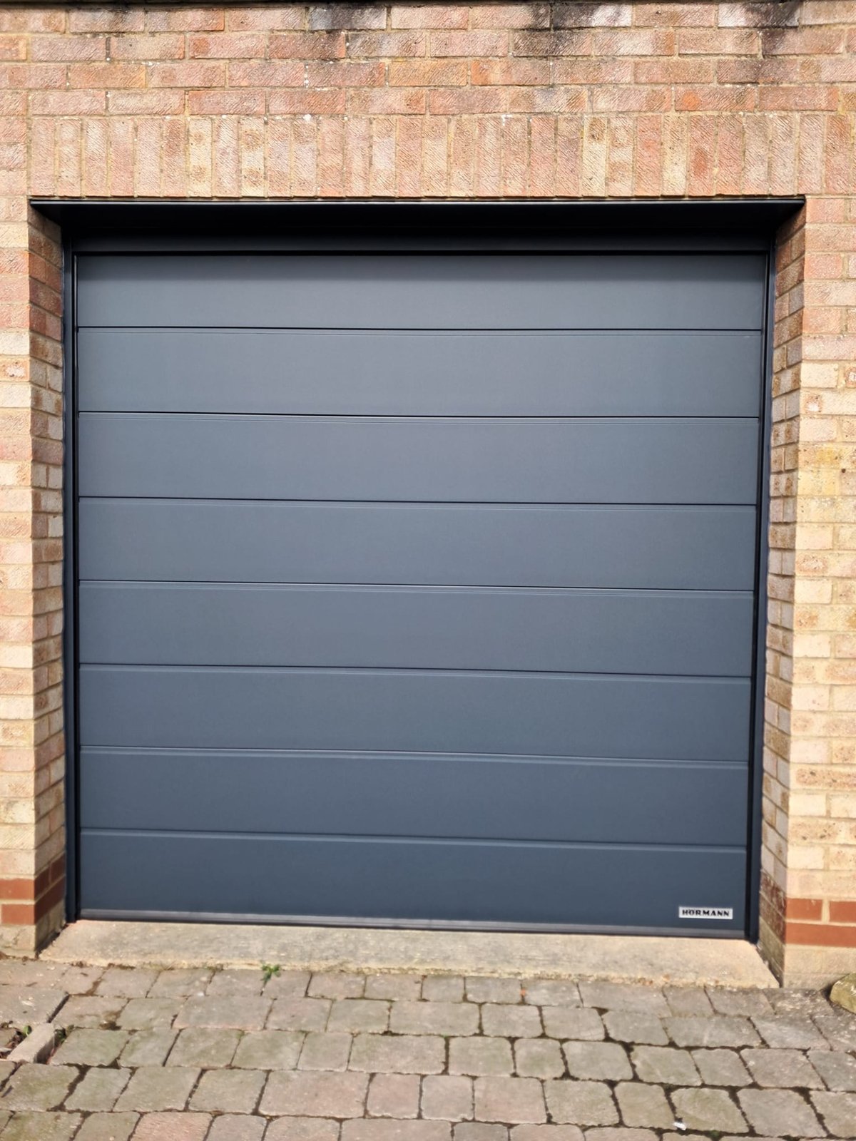 After_-__replacement_insulated_sectional_garage_door_in_anthracite_grey_M_ribbed._Electricaly_operated_(2)