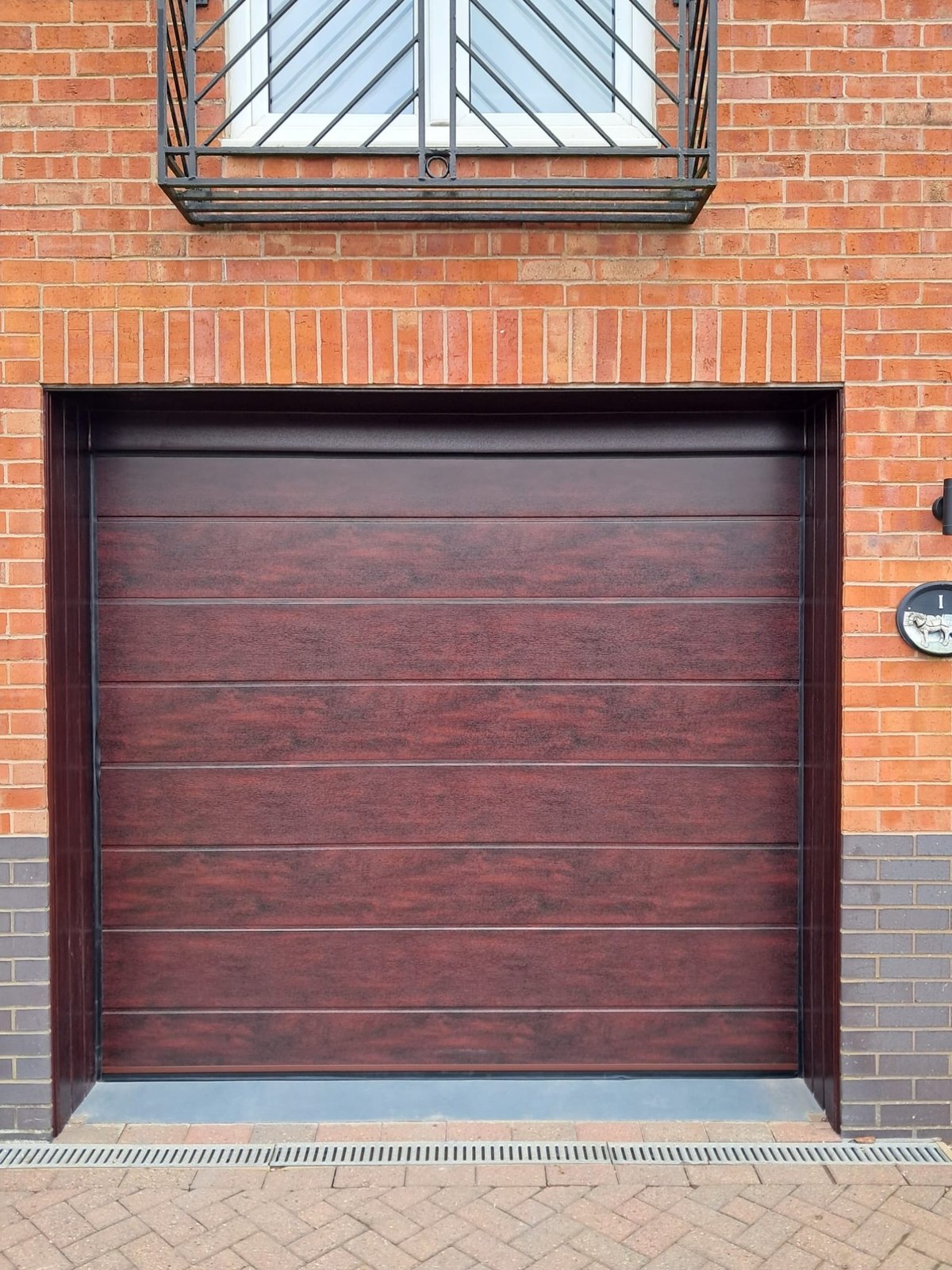 After_-_replaced_with_M-rib_sectional_garage_door_in_Rosewood_with_electric_operation_(2)