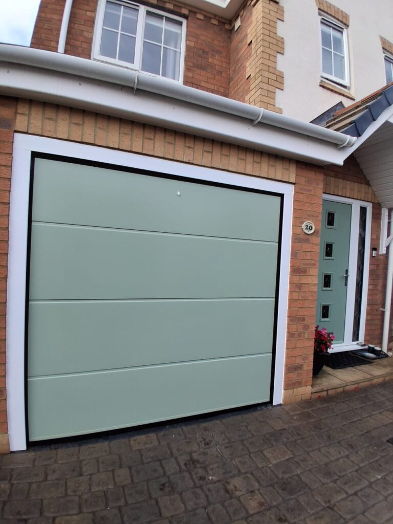 Green sectional garage door matching the front door, Daventry